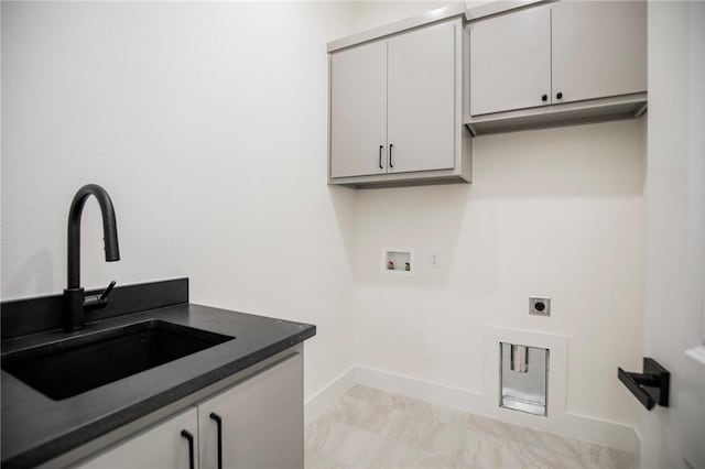 4708 Fieldcrest Ter, Rogers, AR 72758 - laundry area with cabinet space, hookup for an electric dryer, and washer hookup