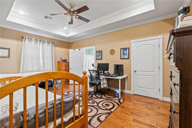 17444 16th Hwy, Siloam Springs, AR 72761 - bedroom with light wood-type flooring, a raised ceiling, ornamental molding, baseboards, and a desk