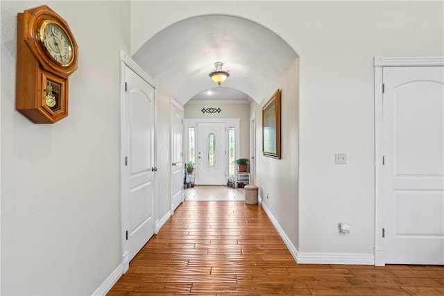 17444 16th Hwy, Siloam Springs, AR 72761 - entryway with wood-type flooring, baseboards, crown molding, and arched walkways