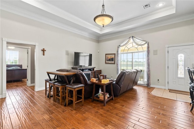 17444 16th Hwy, Siloam Springs, AR 72761 - living room with wood-type flooring, a raised ceiling, baseboards, and crown molding