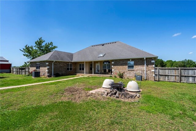 17444 16th Hwy, Siloam Springs, AR 72761 - rear view of property featuring brick siding, a patio, and central AC