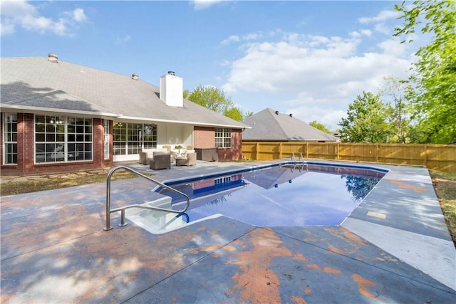 view of swimming pool featuring a patio area, a fenced backyard, a fenced in pool, and outdoor lounge area