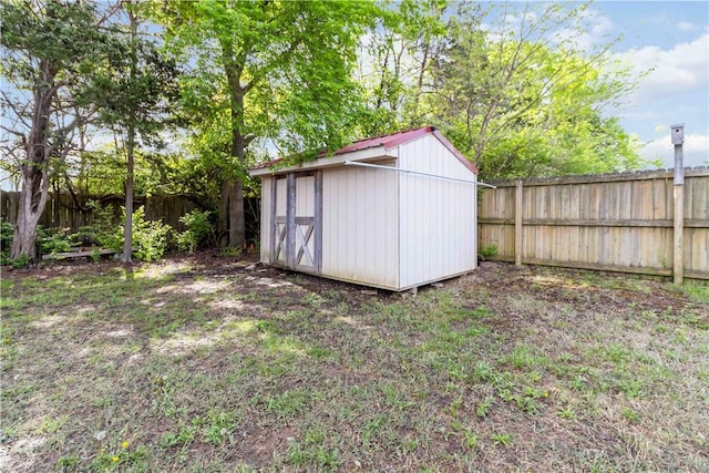 view of shed with a fenced backyard
