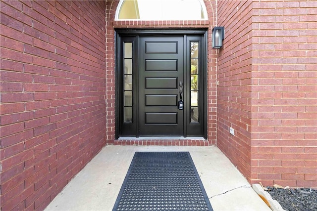 entrance to property with brick siding