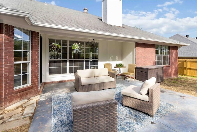 view of patio / terrace with fence and an outdoor living space