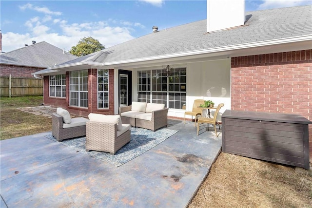 view of patio with fence and an outdoor living space