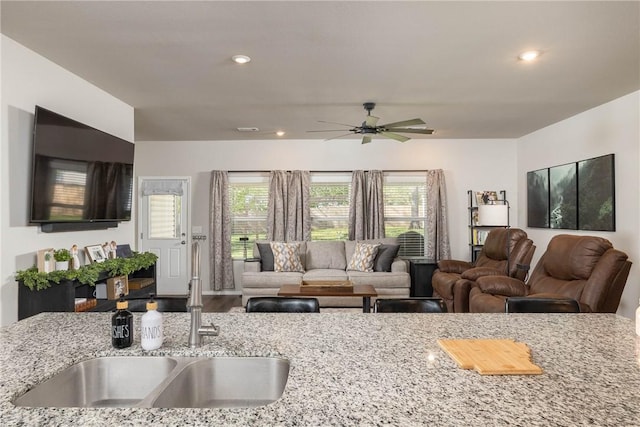 living area featuring wood finished floors, recessed lighting, and ceiling fan