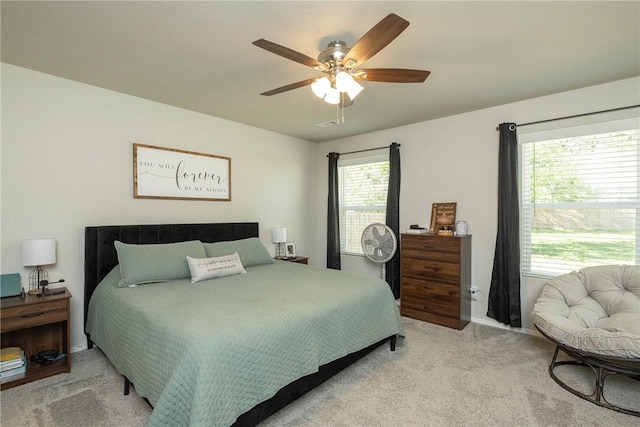 carpeted bedroom with a ceiling fan