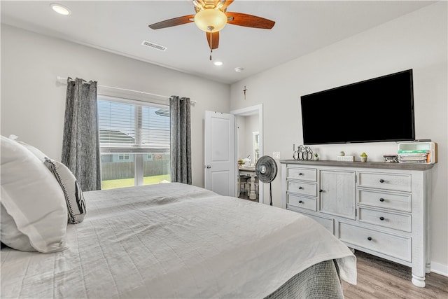 bedroom featuring recessed lighting, light wood finished floors, visible vents, baseboards, and ceiling fan