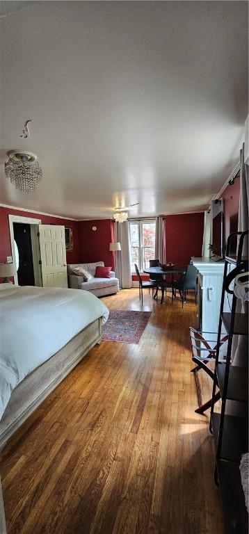 bedroom with wood finished floors
