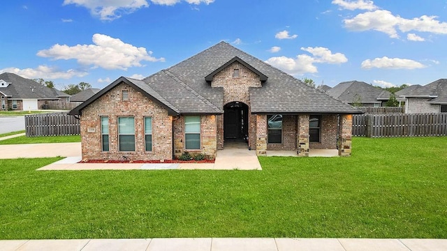 2310 Carper Ln, Pea Ridge, AR 72751 - french provincial home featuring brick siding, a shingled roof, and a residential view