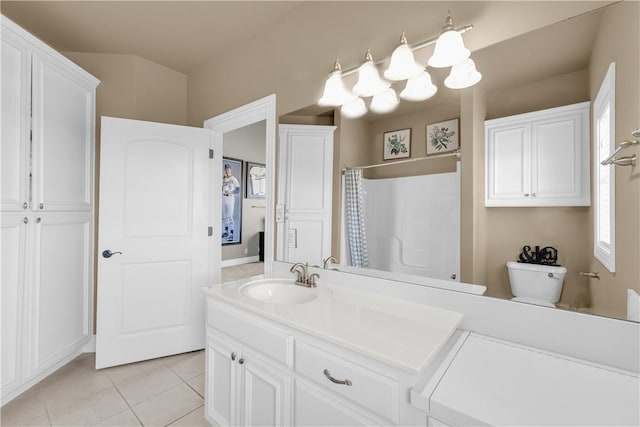 bathroom with tile patterned floors, vanity, a shower with shower curtain, and toilet