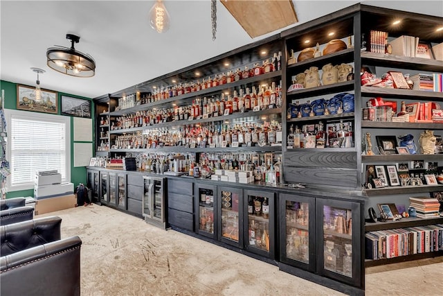 interior space featuring a bar and wine cooler