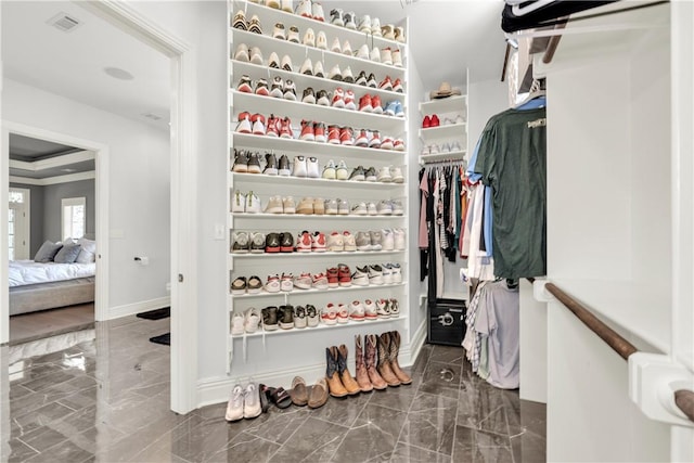 spacious closet with visible vents and marble finish floor
