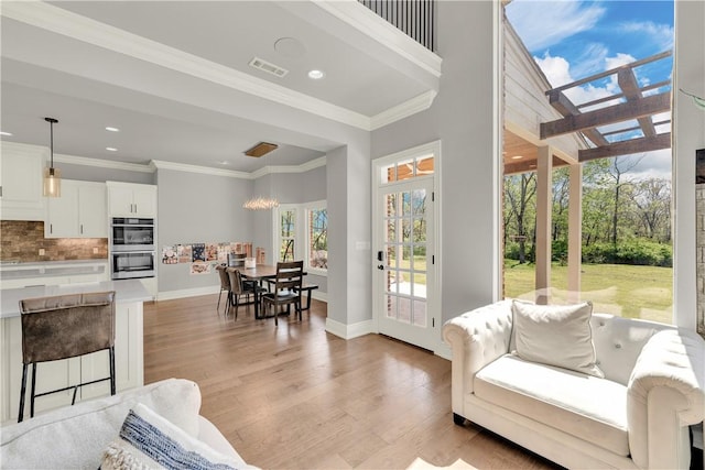 interior space with baseboards, visible vents, recessed lighting, and light wood-style floors