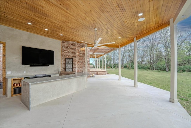 view of patio featuring a ceiling fan