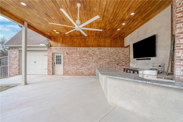 view of patio / terrace with exterior kitchen and ceiling fan