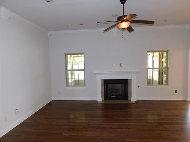 unfurnished living room with crown molding and wood finished floors