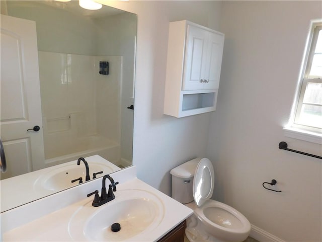 bathroom featuring toilet and vanity