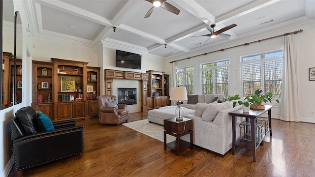 5309 S Promontory Ct, Rogers, AR 72758 - living area with a ceiling fan, dark wood-type flooring, beam ceiling, a high end fireplace, and coffered ceiling