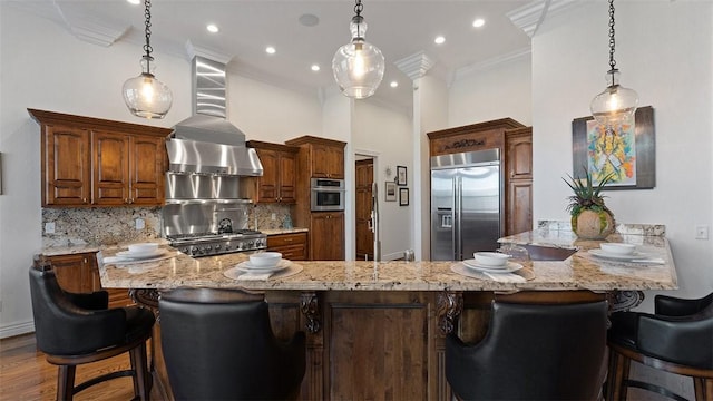 5309 S Promontory Ct, Rogers, AR 72758 - kitchen with built in refrigerator, a peninsula, backsplash, a breakfast bar, and pendant lighting