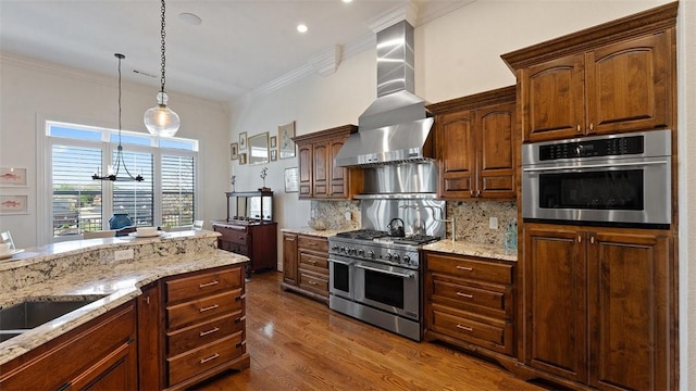 5309 S Promontory Ct, Rogers, AR 72758 - kitchen with appliances with stainless steel finishes, wall chimney exhaust hood, ornamental molding, dark wood finished floors, and backsplash