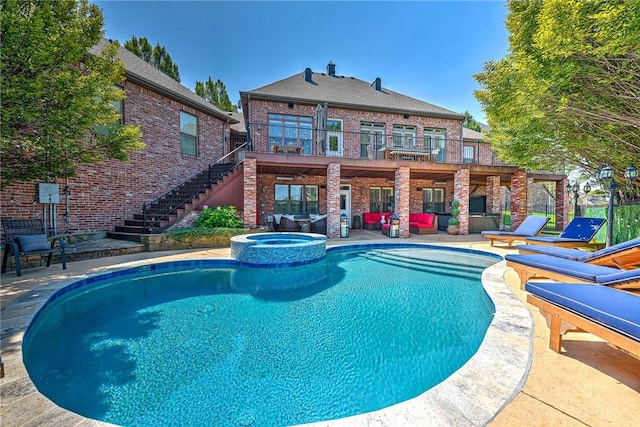 5309 S Promontory Ct, Rogers, AR 72758 - view of pool featuring stairway, an outdoor hangout area, a patio, and a pool with connected hot tub