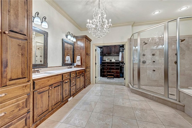 5309 S Promontory Ct, Rogers, AR 72758 - bathroom featuring ornamental molding, a stall shower, double vanity, a chandelier, and a spacious closet