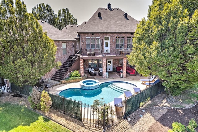 5309 S Promontory Ct, Rogers, AR 72758 - view of pool with stairs, outdoor lounge area, a fenced backyard, a patio, and a pool with connected hot tub
