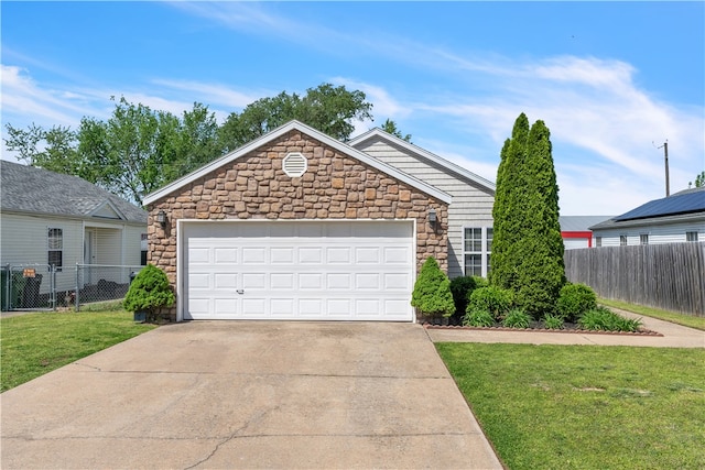 1908 S Pinewoods Dr, Rogers, AR 72758 - ranch-style home featuring a front lawn, stone siding, concrete driveway, and fence