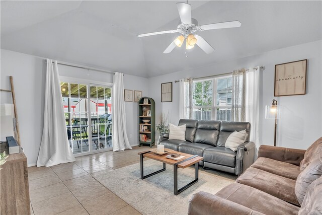 1908 S Pinewoods Dr, Rogers, AR 72758 - living area featuring vaulted ceiling, ceiling fan, plenty of natural light, and light tile patterned floors