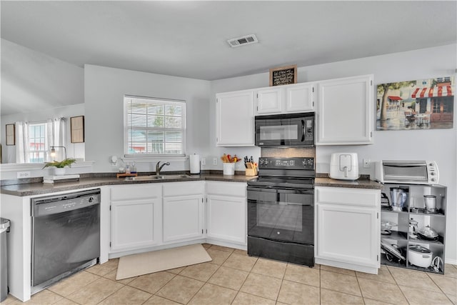 1908 S Pinewoods Dr, Rogers, AR 72758 - kitchen featuring dark countertops, white cabinetry, a sink, and black appliances