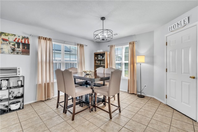 1908 S Pinewoods Dr, Rogers, AR 72758 - dining area featuring baseboards, a chandelier, and light tile patterned floors