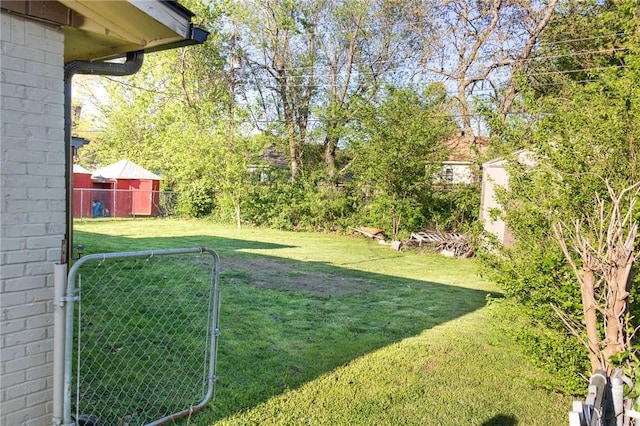 view of yard featuring a gate and fence