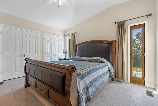 bedroom featuring multiple windows, access to outside, multiple closets, and light tile patterned flooring
