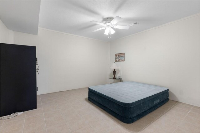 bedroom with crown molding, ceiling fan, and light tile patterned flooring