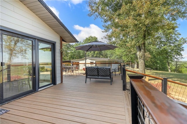 wooden deck with outdoor dining space