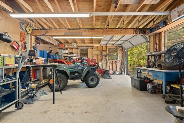 garage with a workshop area