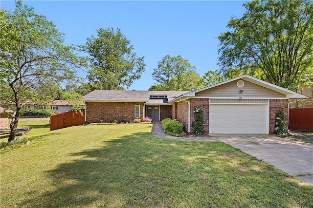 ranch-style home featuring fence, an attached garage, brick siding, and concrete driveway