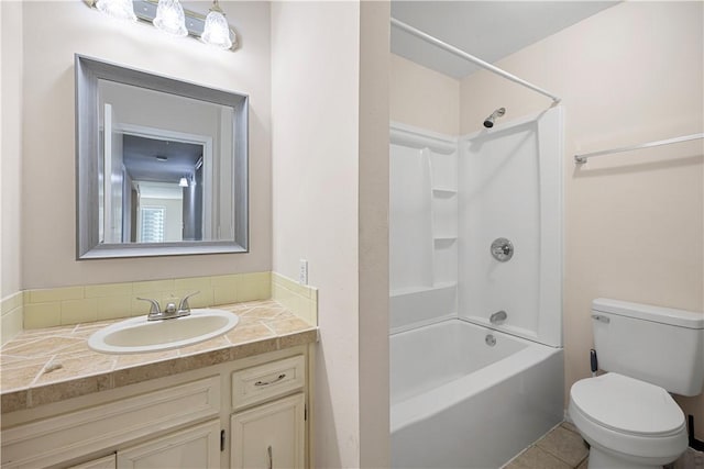 full bathroom featuring shower / bathing tub combination, tile patterned floors, vanity, and toilet