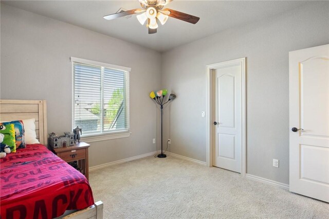 bedroom featuring carpet, baseboards, and ceiling fan