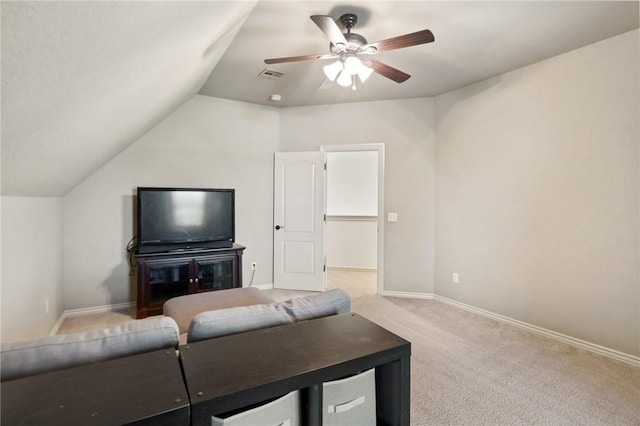 living area featuring vaulted ceiling, visible vents, a ceiling fan, light carpet, and baseboards