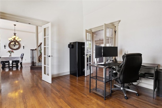 office with dark wood finished floors, baseboards, french doors, and a chandelier