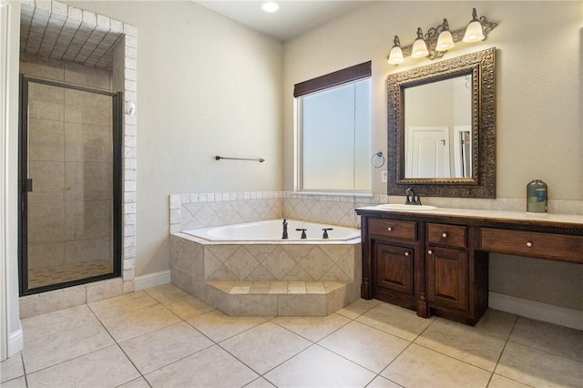 full bathroom featuring tile patterned flooring, a garden tub, vanity, and a stall shower