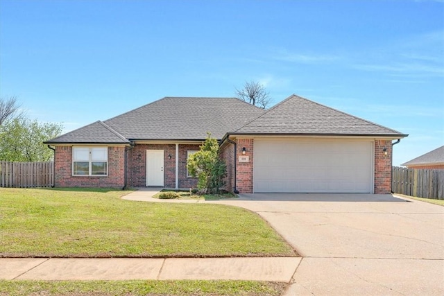ranch-style home featuring fence, an attached garage, a front yard, and concrete driveway