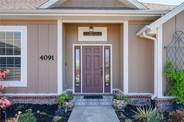 4091 Ridgeton St, Springdale, AR 72764 - entrance to property with board and batten siding, a porch, and roof with shingles