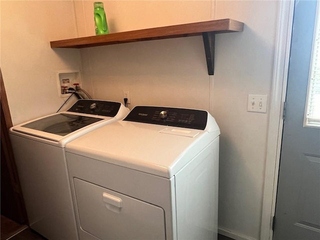 laundry area with separate washer and dryer and laundry area