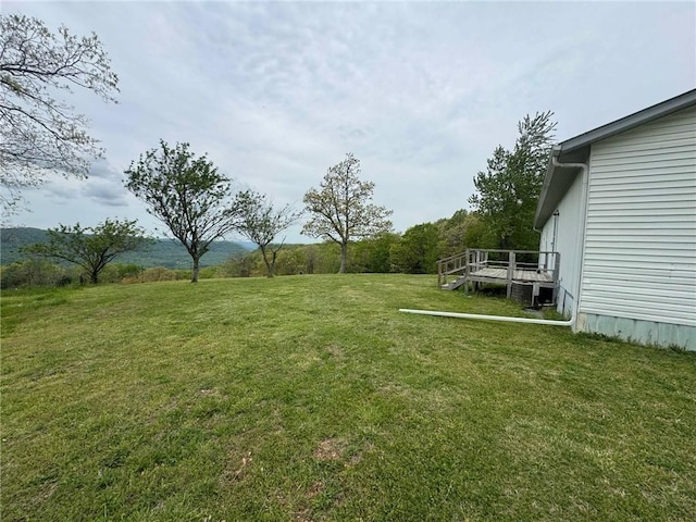 view of yard featuring a wooden deck