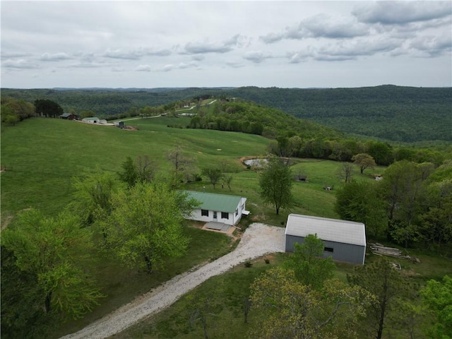 birds eye view of property with a rural view