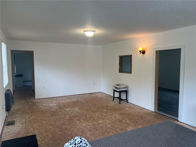 spare room featuring visible vents